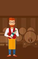 Image showing Waiter holding bottle of wine.