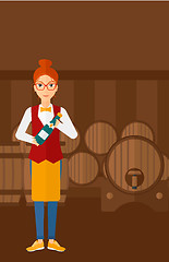 Image showing Waitress holding bottle of wine.