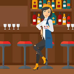 Image showing Woman sitting at bar.