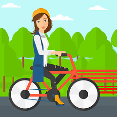 Image showing Woman riding bicycle.