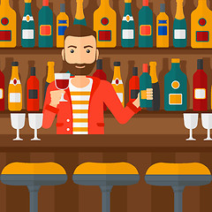 Image showing Bartender standing at the bar counter.