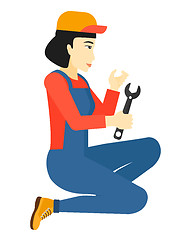 Image showing Repairer holding spanner.