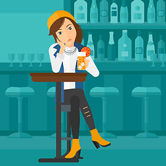 Image showing Woman sitting at bar.