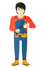 Image showing Cheerful repairman with spanner.