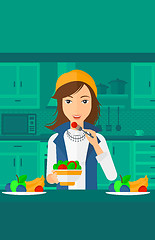 Image showing Woman eating salad.