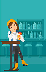 Image showing Woman sitting at bar.