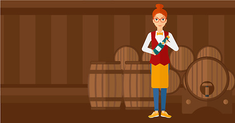 Image showing Waitress holding bottle of wine.