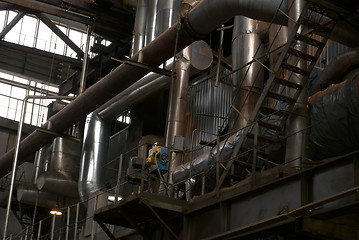 Image showing Different size and shaped pipes at a power plant