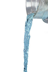 Image showing close up of water jet flowing from glass jug