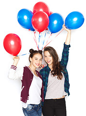 Image showing happy teenage girls with helium balloons