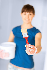 Image showing woman with paintbrush and paint pot