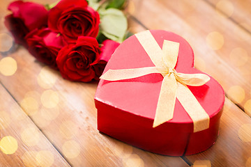 Image showing close up of heart shaped gift box and red roses