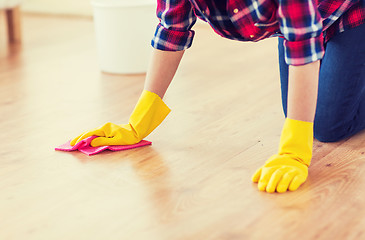 Image showing close up of woman with rag cleaning floor at home