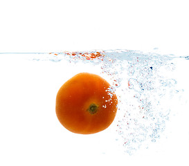 Image showing tomato falling or dipping in water with splash