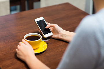 Image showing close up of woman with smartphone and coffee