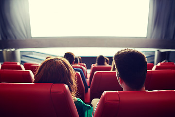 Image showing happy couple watching movie in theater or cinema