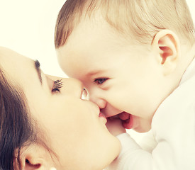 Image showing mother kissing her baby