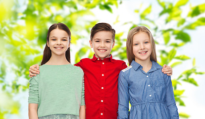 Image showing happy boy and girls hugging