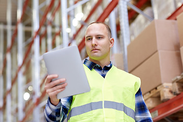 Image showing manual worker with tablet pc at warehouse