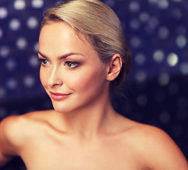 Image showing close up of young woman sitting in bath towel