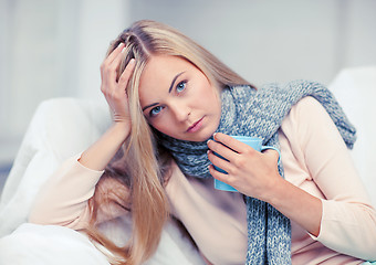 Image showing diseased woman with cup of tea