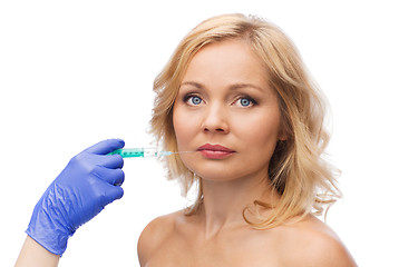 Image showing woman face and beautician hand with syringe