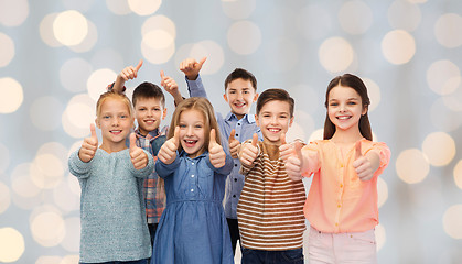 Image showing happy children showing thumbs up