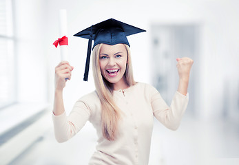 Image showing student in graduation cap with certificate