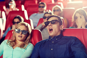 Image showing friends watching horror movie in 3d theater