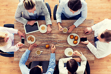 Image showing close up of business team drinking coffee on lunch