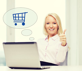 Image showing happy businesswoman with laptop showing thumbs up