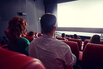 Image showing happy couple watching movie in theater or cinema