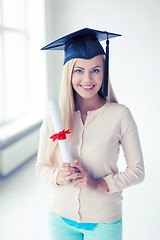 Image showing student in graduation cap with certificate