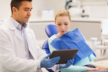 Image showing male dentist with tablet pc and woman patient