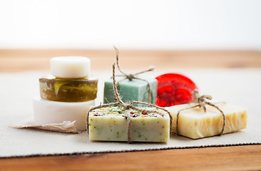 Image showing close up of handmade soap bars on wood