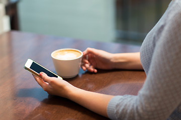 Image showing close up of woman with smartphone and coffee