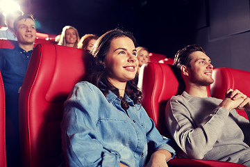 Image showing happy friends watching movie in theater