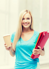 Image showing smiling student with folders