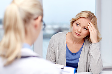 Image showing smiling doctor and woman meeting at hospital