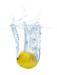 Image showing lemon falling or dipping in water with splash