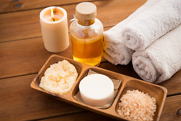 Image showing close up of natural cosmetics and bath towels