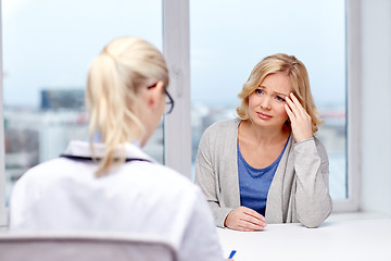 Image showing smiling doctor and woman meeting at hospital