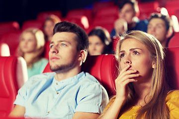 Image showing happy friends watching horror movie in theater