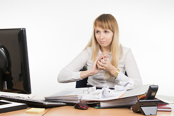 Image showing Director of the office mischief crumples paper document and looking at the monitor screen