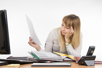 Image showing Tired office of a specialist reading the paper document