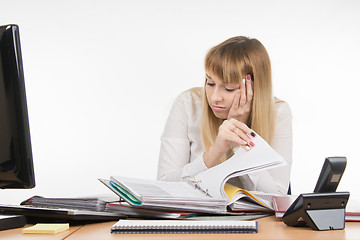 Image showing Tired falls asleep digging a specialist office folders with documents