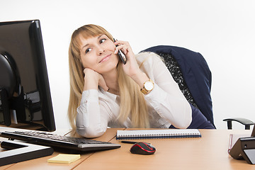 Image showing Happy business woman having fun talking on a cell phone in the office