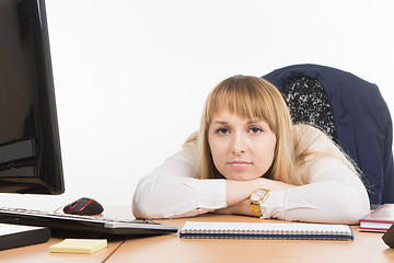 Image showing Sad office a specialist lay on the desktop