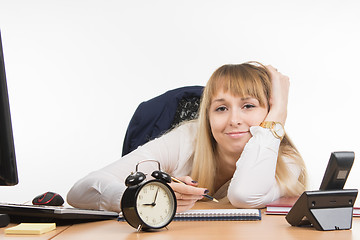 Image showing Tired office employee tries to schedule the working day