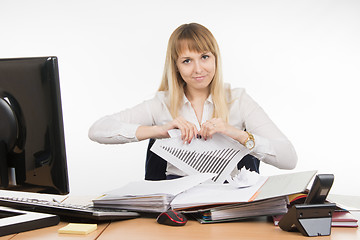 Image showing Business woman tearing paper with the schedule